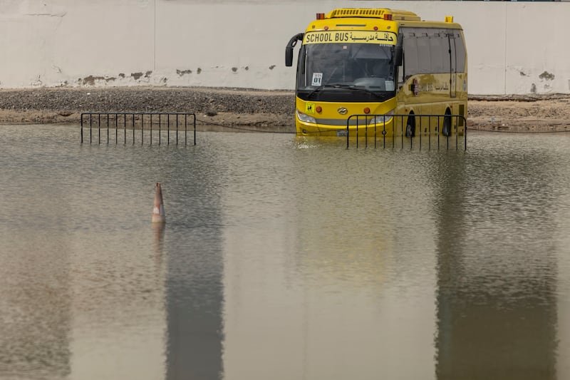 School buses on hand to drive pupils through the water after the flood. Antonie Robertson / media