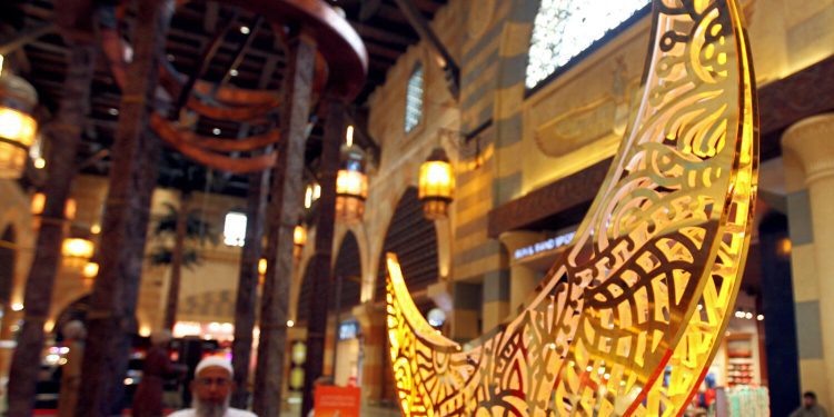 NA040716-RG-EID. A muslim man looking to the Eid decoration at the IBN Battuta Mall Dubai on 04rd June 2016. Photo By: Rahul Gajjar