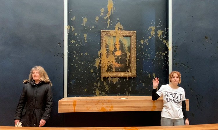 Climate activists make Mona Lisa 'drink' pumpkin soup at Louvre in Paris