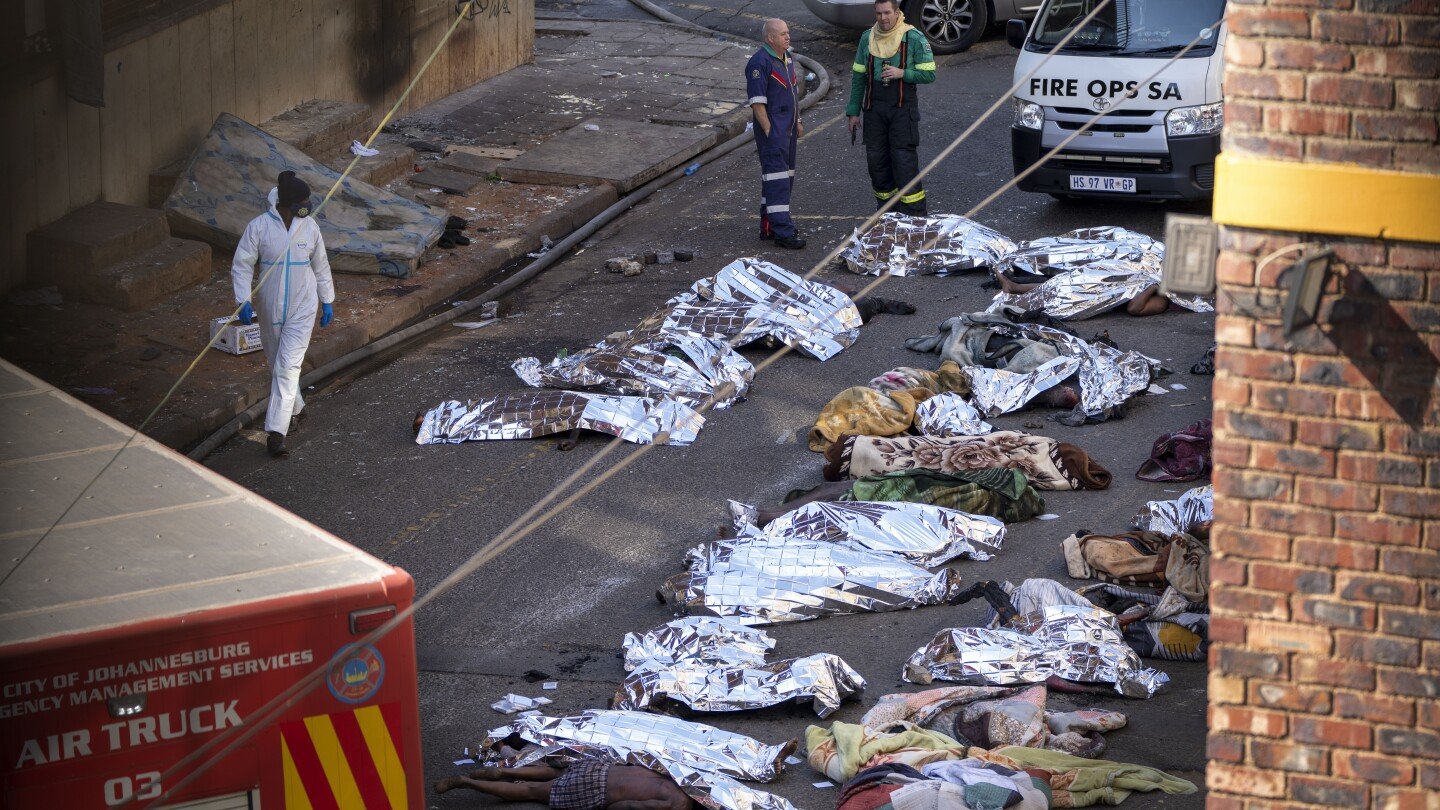South African police arrest a man who says he started a fire that left 76 dead to hide a killing