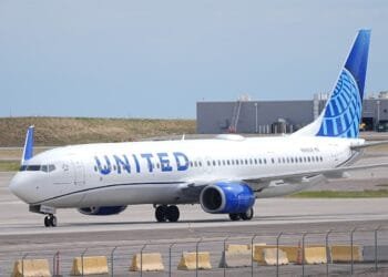 A flyer says a United Airlines pilot forcibly removed him from an airplane bathroom. Now he is suing