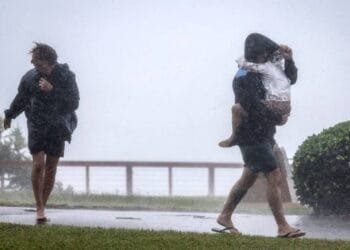 Australian homes lose power and people evacuate as tropical cyclone approaches; 1 man missing