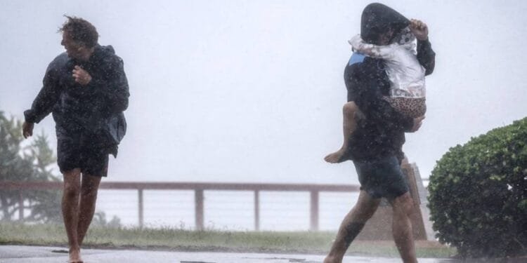 Australian homes lose power and people evacuate as tropical cyclone approaches; 1 man missing