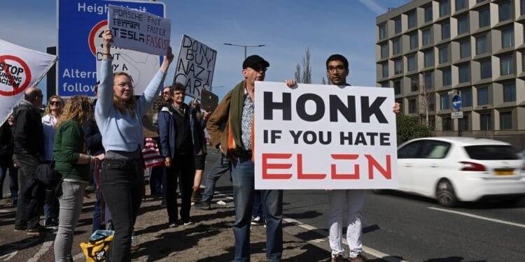 Elon Musk protesters gather at Tesla showrooms