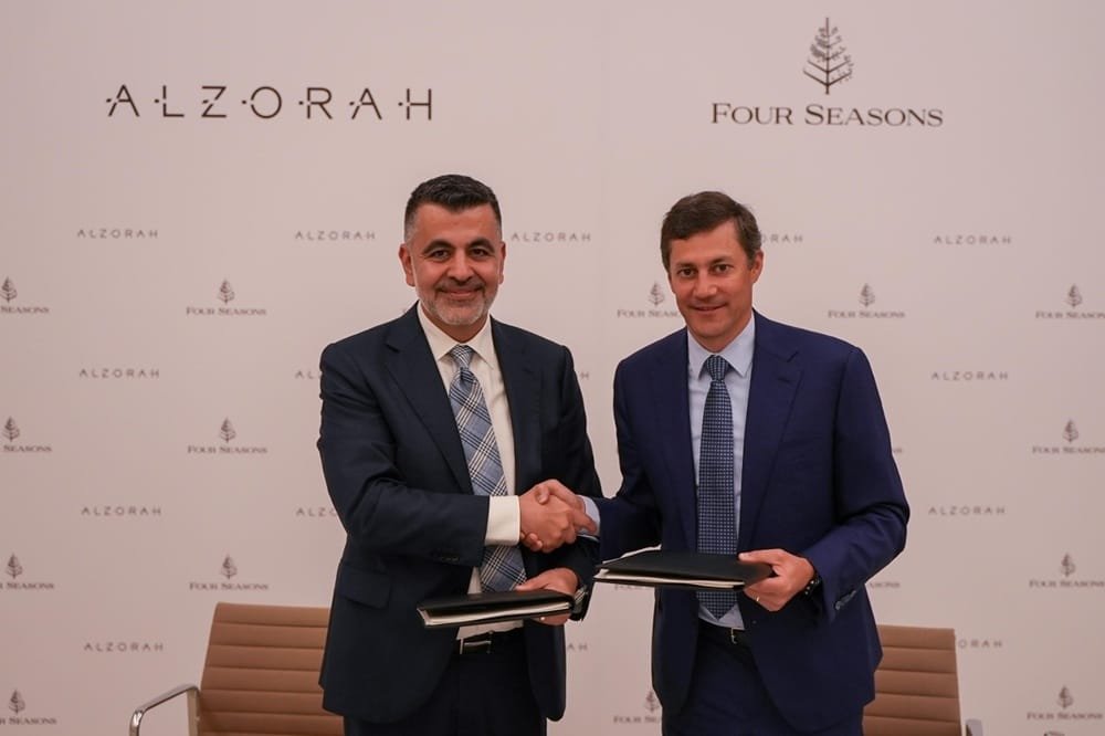 From left George Saad CEO of Al Zorah Development Company and Adrian Messerli Area President Hotel Operations EMEA at Four Seasons during the signing of the agreement
