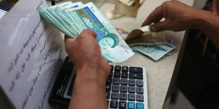 Iran’s currency drops to record low against dollar as tensions soar