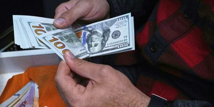 Iran’s currency falls to record low against the dollar as tensions run high