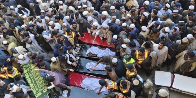 Pakistanis mourn 18 people killed in suicide bombing at an army base