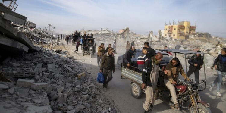 Palestinians trek across rubble to return to their homes as Gaza ceasefire takes hold
