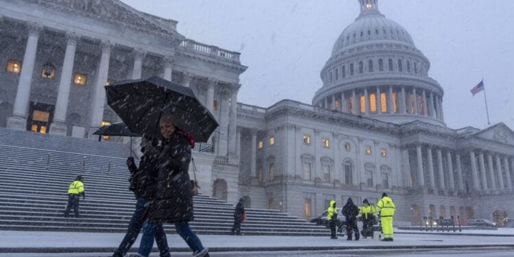 Snow and freezing rain cause crashes in Virginia while California prepares for likely flooding