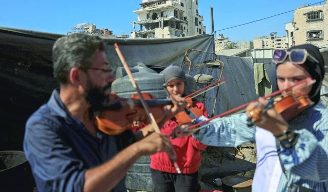 Strings of hope in a city of ruins 1 ahmed abu amsha conducts a music lesson photo reuters