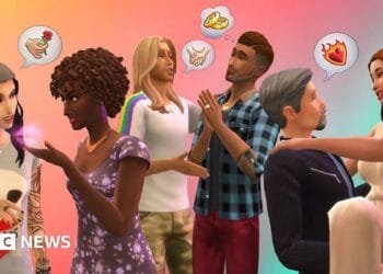 A screenshot from The Sims shows six characters in a kitchen setting, viewed from an isometric, top-down perspective. All of them are wearing party hats, and one sits at a table in front of a large cake with lit candles on top. The other characters stand in a line behind them, with birthday cake thought bubbles above their heads.