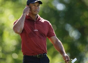 Tiger Woods says he ruptured his Achilles tendon, an injury that will keep him out of the Masters