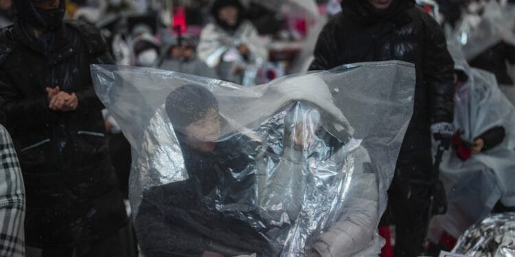 Top aide of impeached South Korean president pleads for investigators to halt detention efforts